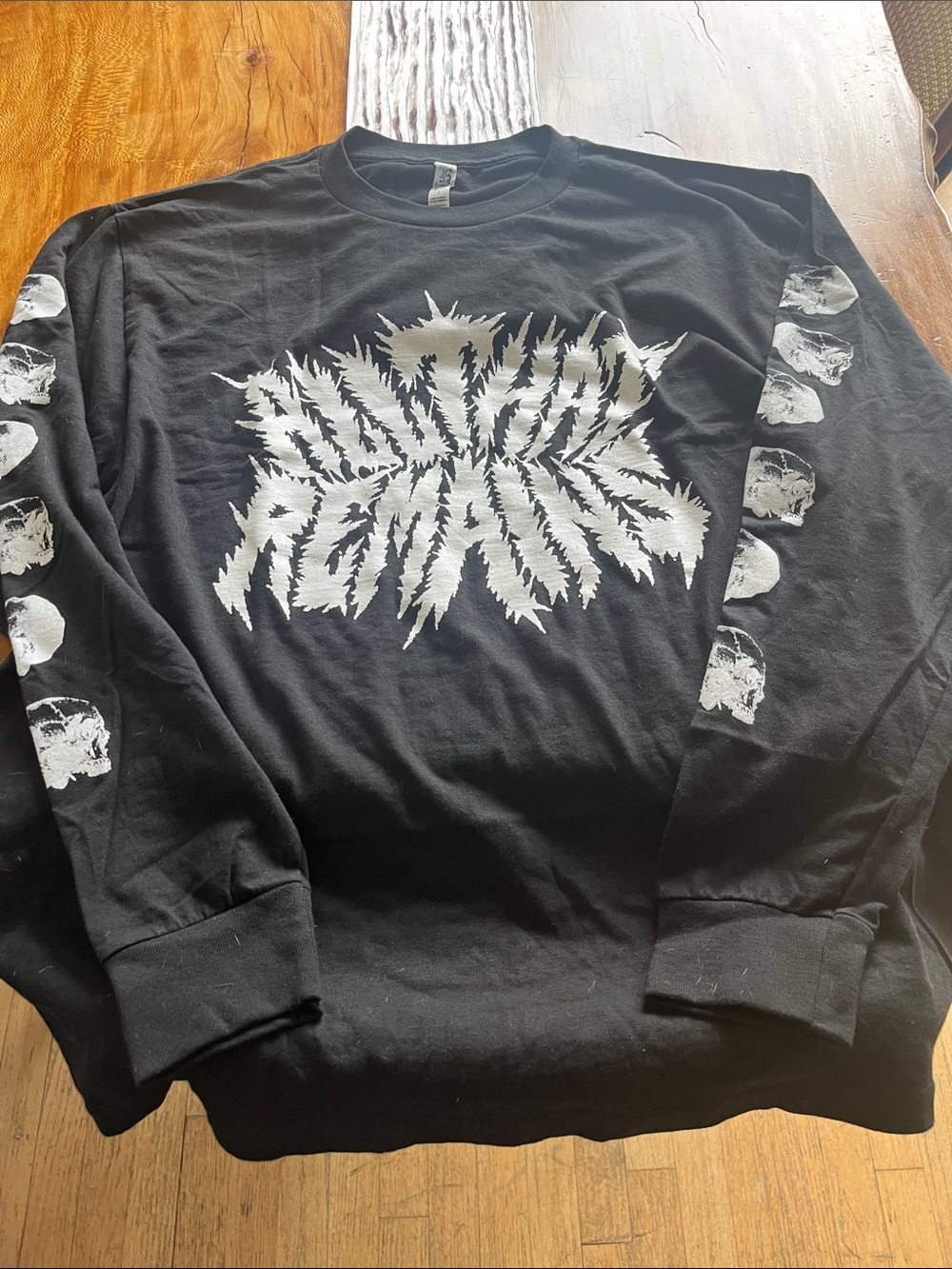 Black Long-Sleeve Graphic Tee with Skull Sleeve Detail